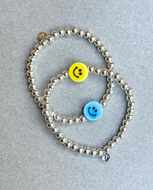 Sterling silver stretch bracelet with porcelain smiley bead